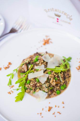 a plate of food on a white plate at Hotel Gdańsk Boutique in Gdańsk