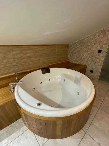 a large wooden bath tub in a bathroom at Mirador de Aledo in Aledo