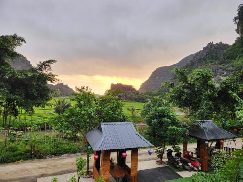 a group of people sitting in a gazebo at Hang Mua Eco Park in Ninh Binh