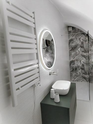 a bathroom with a sink and a mirror at LianHome b&b "Volte" in Lucera