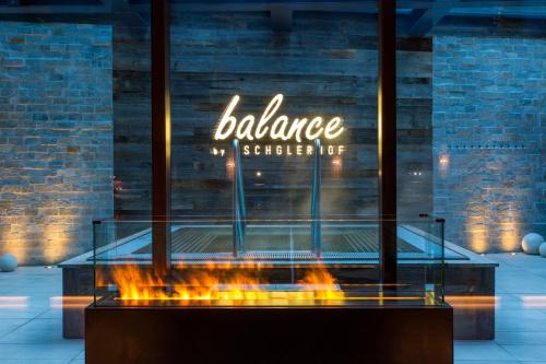 a display case with a fire in front of a store at Alpenhotel Ischglerhof in Ischgl