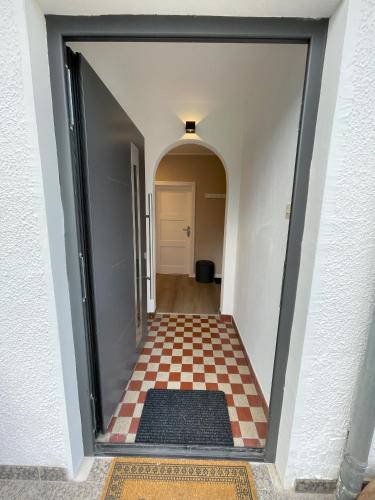 a hallway with a red and white checkered floor at Ferienhaus Mediterran in Bruttig-Fankel für 2-5 Personen in Bruttig-Fankel