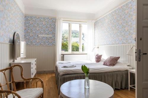 a small room with a bed and a table at Apartment in central Båstad in Båstad