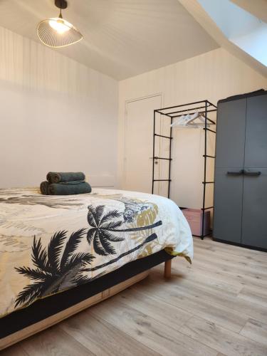 a bedroom with a large bed and a closet at O'Phare Ouest in Plouguerneau