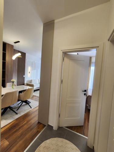 a room with a door leading to a living room at Lux residence Adrijana 1 in Ulcinj