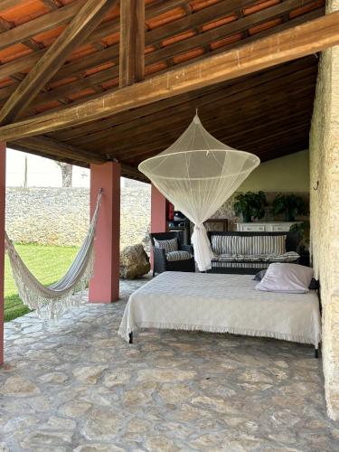 a bedroom with a bed with a net at Casa da Mata in Torres Novas