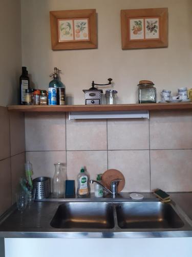a kitchen with a sink and a counter top at Maison Corbigny in Corbigny