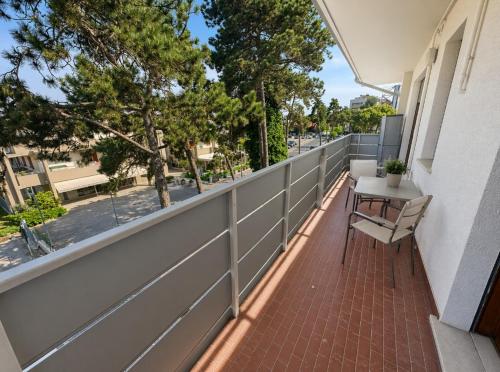 a balcony with a bench and a fence at Residence Patty in Caorle