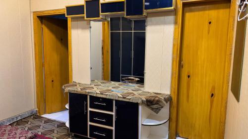 a bathroom with a sink and a mirror at Rsheen Inn in Peshawar