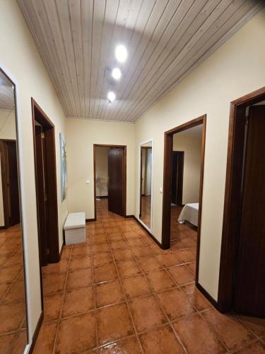 a hallway of a room with a tile floor at Villa Dourada in Porto Santo
