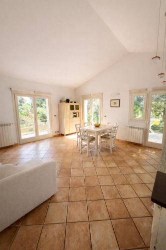 a living room with a table and chairs at La casa di Fedra in Imperia