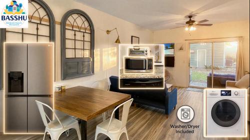 a kitchen with a dining table and a refrigerator at Garden Level 1BR condo, Central Luxury Suite in Wilmington