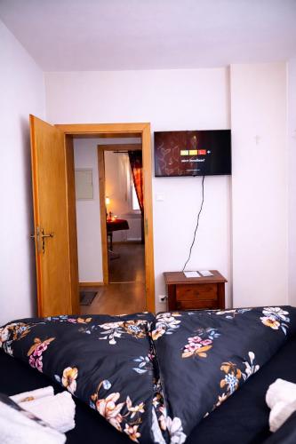 a bedroom with a bed and a door to a room at Holiday Rhein 1 in Boppard
