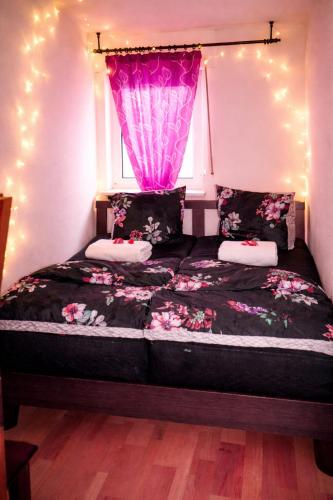 a bedroom with a bed with a window with lights at Holiday Rhein 1 in Boppard