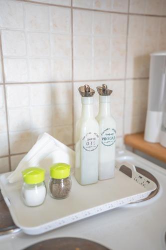 two bottles of milk on a tray on a kitchen counter at Xenia's House in Kefalos