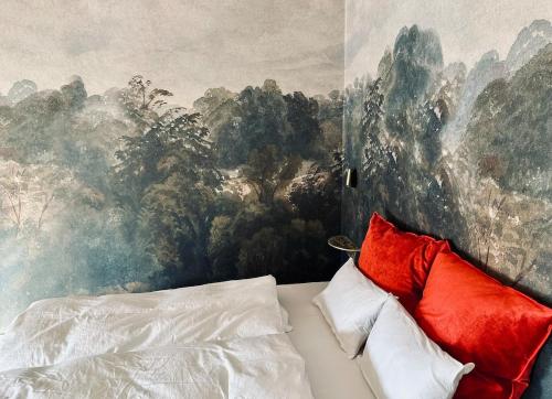 a bedroom with a painting on the wall at Villa Conte Private Urban Hideaway in Wels