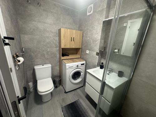 a bathroom with a washing machine and a washer at TAJ house center altea #B in Altea