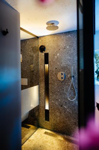 a bathroom with a shower stall with at La petite chambre in Bennekom