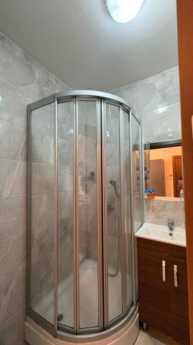 a shower stall in a bathroom with a sink at Ehli Keyf Hotel in Istanbul