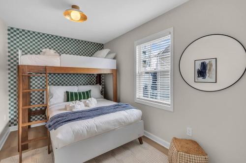 a bedroom with a bunk bed and a mirror at Prof Cleaned | Linen+Towel | Pet Friendly | Coffee in Seaside Heights