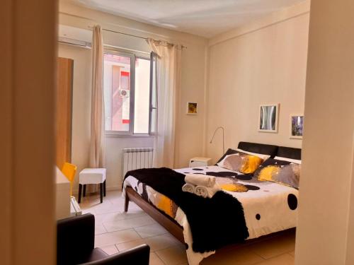 a bedroom with a large bed in a room at Respiro Mediterraneo in Mondello