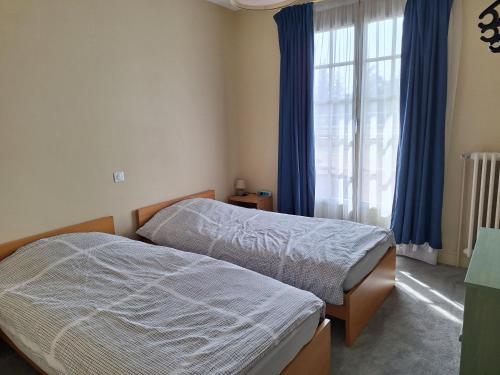 Llit o llits en una habitació de Les Cormiers