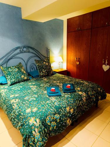 a bedroom with a bed with two trays on it at Cal Jan HUT6-8208 in Aixovall