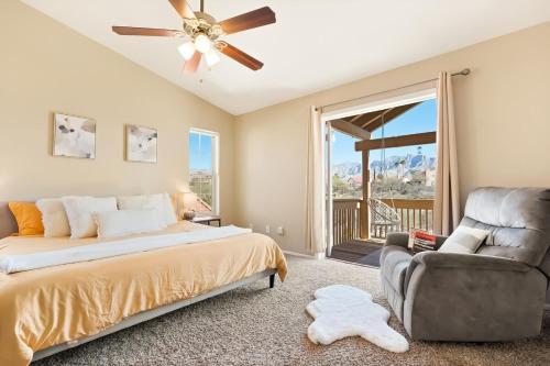 a bedroom with a bed and a couch and a chair at The AZ Escape in Tucson