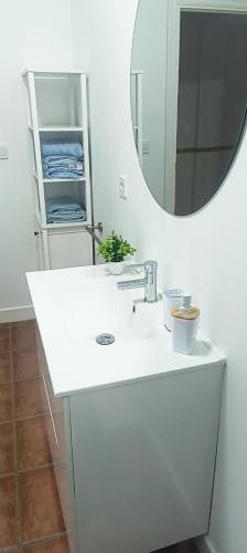 a bathroom with a white sink and a mirror at PUNTA SOL in Isla del Moral