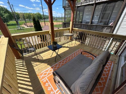 a porch with a couch on a deck at Riverside Hideaway - Brand New Deck! in Cincinnati