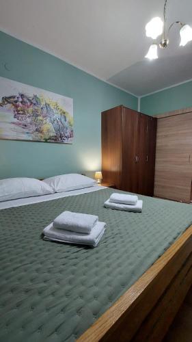 a bedroom with two mattresses on a large bed at Agrotourism Galic Krka in Drinovci