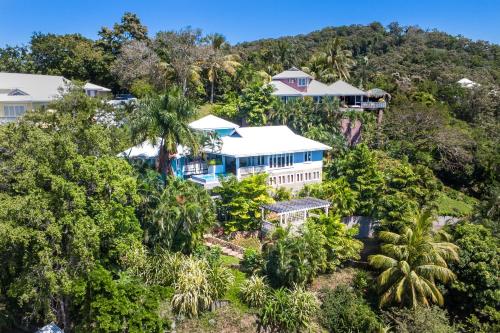 an aerial view of a house in the forest at Top Ridge Views home in Roatán