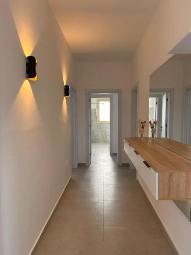 a hallway of a home with a wooden counter top at Marina Oasis Apartments in Vlorë
