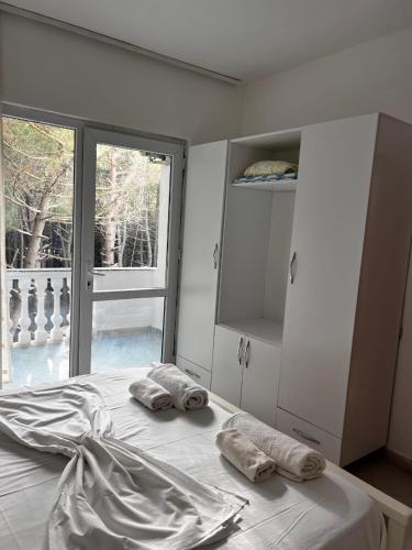 a bedroom with a bed with two pillows on it at H Veza in Spille