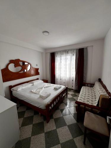 a bedroom with two beds and a window at H Veza in Spille