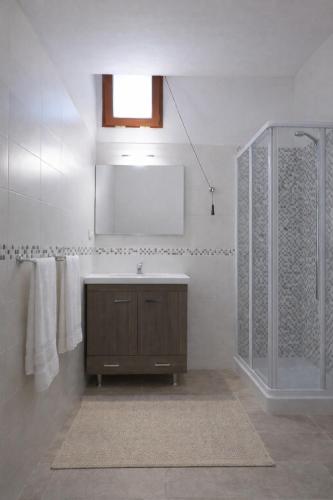 a bathroom with a sink and a shower at Cilento House with Garden & Sunset View in Sessa Cilento