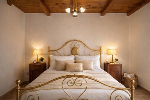a bedroom with a large bed with two night stands at Cilento House with Garden & Sunset View in Sessa Cilento