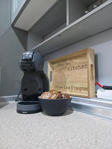a food processor and a bowl of food on a counter at Fantazy Apartment Main Square FREE PARKING in Skopje