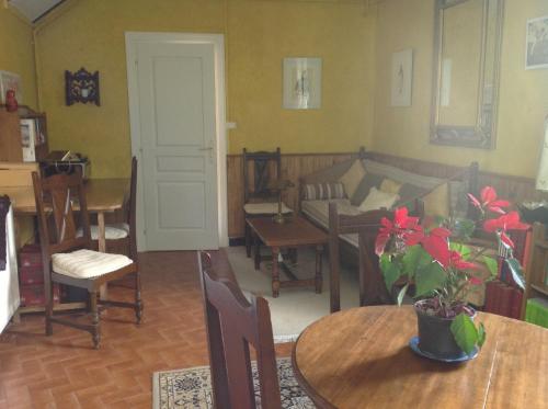 a living room with a couch and a table at Maison Lacoste in Campan