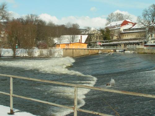 a body of water with snow on it at hausamsolschacht in Bad Kösen