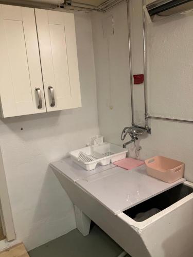 a kitchen counter with a sink and a mirror at Vacation Home in Oslo in Oslo