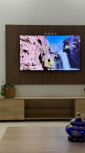 a flat screen tv sitting on top of a table at Luxury Terrace Apartment in Al Hoceïma