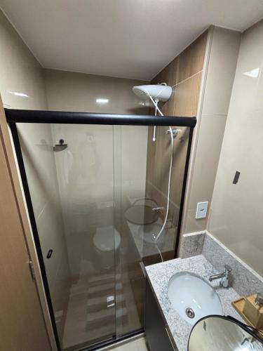 a bathroom with a shower and a sink at Studio nascente na Pituba in Salvador
