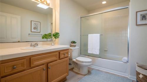 a bathroom with a sink and a toilet and a shower at Hidden Coastal Gem Between Malibu & SB in Oxnard