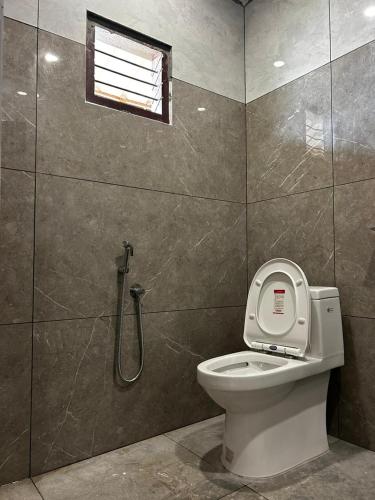 a bathroom with a toilet and a shower at brothers holidayas vagamon in Vagamon