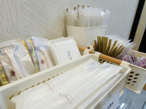 a drawer filled with lots of wrapping paper at Tabist ONSEN MOTEL272 in Naka-shibetsu
