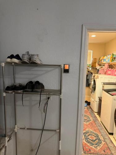 a shelf with shoes on it in a kitchen at Goodyear 2 Story Room 2 in Goodyear
