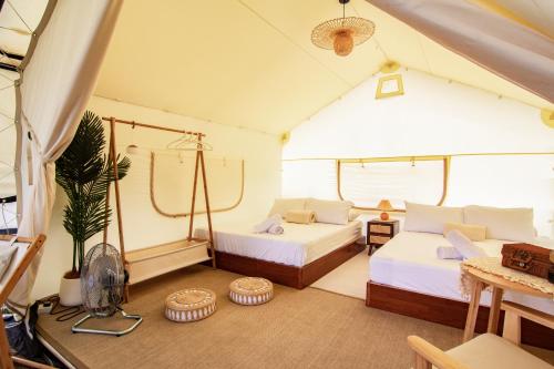 a bedroom with two beds in a tent at Suka Camping - Bentong in Bentong
