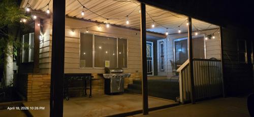 a screened in porch of a house at night at 4 River Lake Sea in Parker