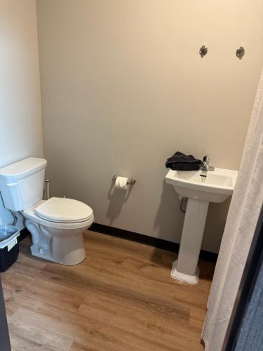 a bathroom with a toilet and a sink at Airstay LLC in Clark